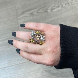 Wide 3-tone flower ring with CZ accents.